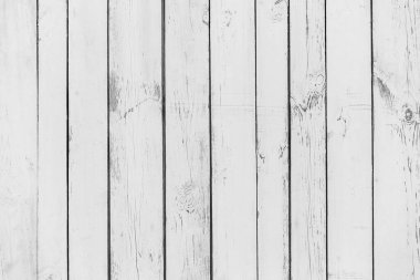 Beyaz çit tahtaları, açık ahşap döşeme arka planı.