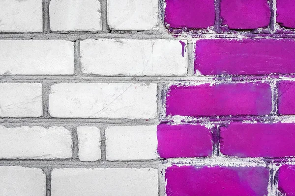 Old white dirty brick art wall design texture with purple paint background.