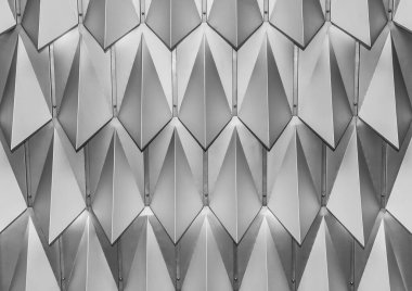 Siyah ve beyaz geometrik doku, iç mekanda soyut metal deseni, simetrik mimari çelik zemin.