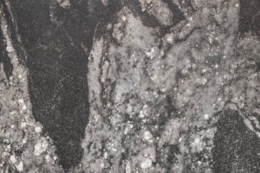 Koyu gri mermer taş yüzey ya da soyut desen arkaplanı olan granit döşeme..