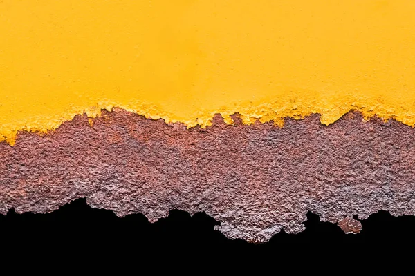 Yellow orange paint on an old metallic texture with a rusty pattern of corrode flakes.