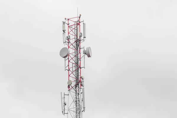 High-rise mobile internet tower air communications industry against the background of gray sky.