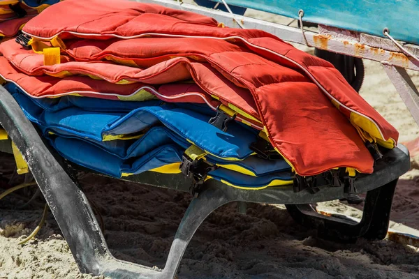 Life jackets, protection and safety of life on the water against the background of the sea.