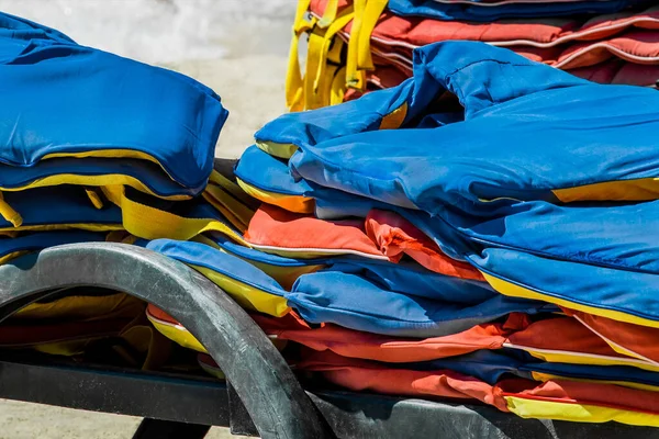 Life jackets, protection and safety of life on the water against the background of the sea.