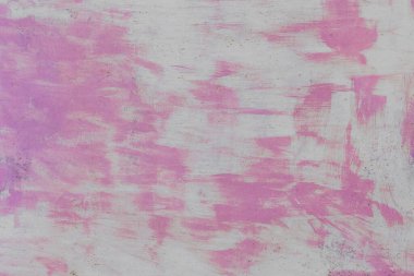 Eski kirli çelik desen yüzey metal arka planında soyut pembe boya deseni.