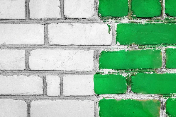Old white dirty brick art wall design texture with green paint background.