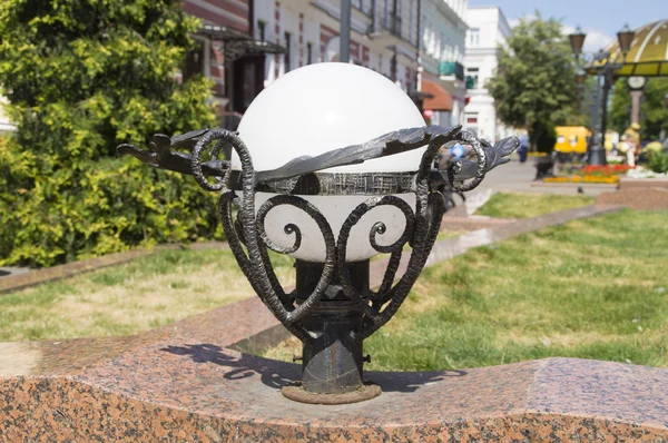 Lighting the lamp in a decorative frame on the marble railing — Stock Photo, Image