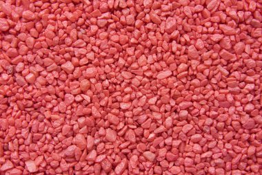 Kırmızı dekoratif küçük taşların dokusu. Soyut arkaplan. Kaya deseni.