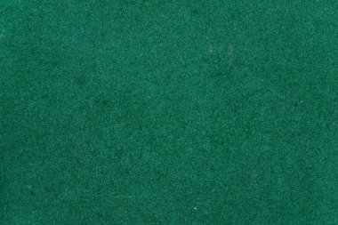 Arkaplan olarak kullanmak için soyut koyu yeşil detaylı doku. Tasarım için zemin. Kırıntı kauçuk kaplama.
