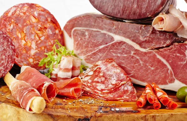 Board with salami and ham — Stock Photo, Image