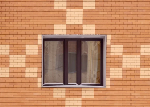 Geometric pattern on the wall with window and blinds