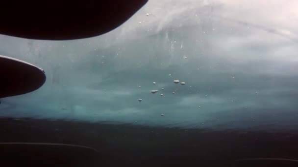 Researcher traveler diver underwater under ice on bottom of Lake Baikal. — Stock Video