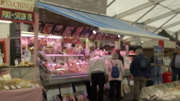 People near showcase with meat on spring festival of food RHS Malvern Hills. — Stock Video