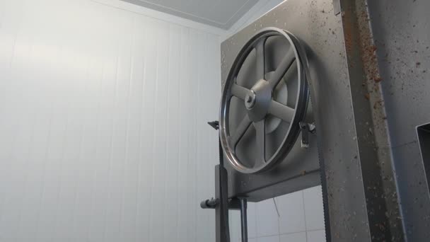 Man worker washes and details of meat cutting equipment in industrial workshop. — Stock Video