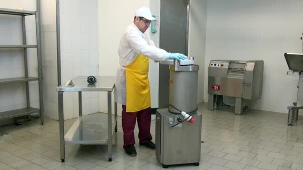 Man worker disassemble equipment for production of sausages parts. — Stock Video