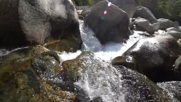 Water swirls boils in swirling churning mountain river Verzaska in Switzerland. — Stock Video