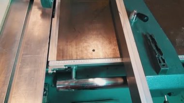 Woodworking machine  with a circular saw saws veneer angle. Two circular saws of woodworking machine.