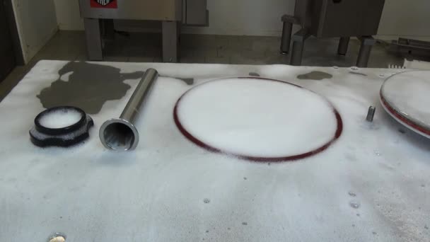 Cleaning the detergent machine parts for the production of sausages. — Stock Video