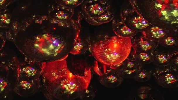 Mirror balls reflect rays of colored lights. — Stock Video