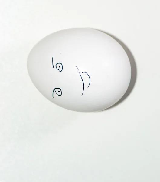 Eier im Gesicht eines Menschen — Stockfoto