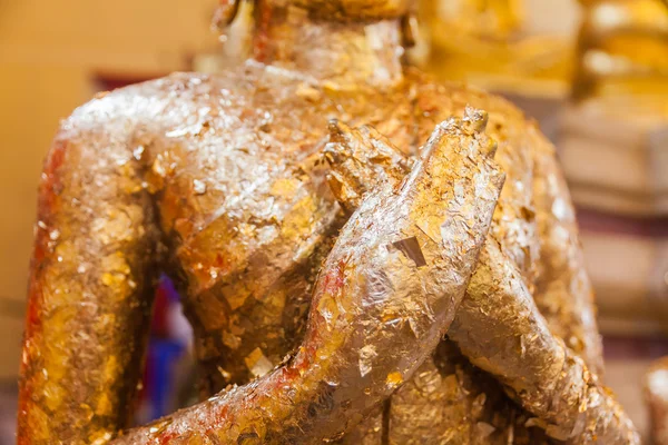 Closeup hand of gilded ancient buddha statue — Stock Photo, Image