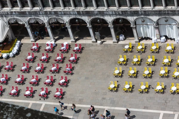 Red and Yellow Chairs and Round Tables Aerial View on Saint Mark