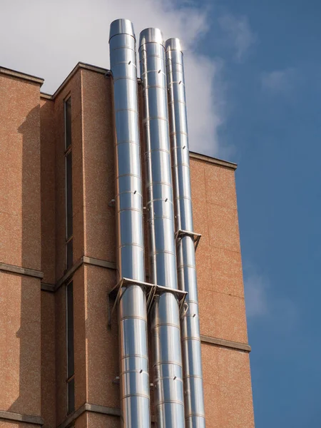 Three Big Vertical Steel Pipes Attached Exterior Wall Building — Stock Photo, Image