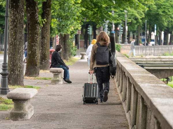 Boy Long Hair Seen Walking Public Street Trolley Suitcase Guitar — Stock Photo, Image