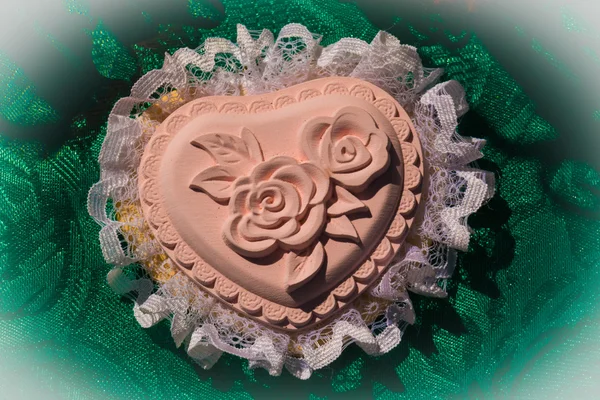 Heart handmade decoration with a rose in the middle and lace aro — Stock Photo, Image