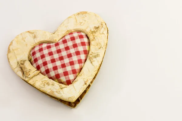 Corazón de madera, textil cuadrado en el centro —  Fotos de Stock