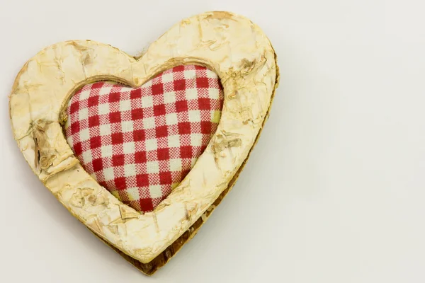 Corazón de madera, textil cuadrado en el centro —  Fotos de Stock