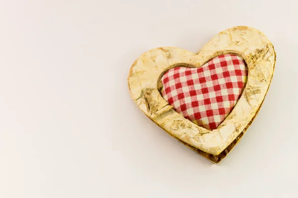 Corazón de madera, textil cuadrado en el centro —  Fotos de Stock