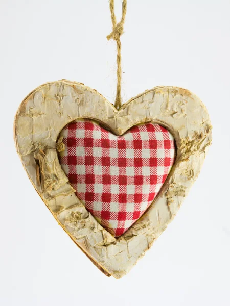 Dřevěné srdce, čtvercový textilní uprostřed — Stock fotografie