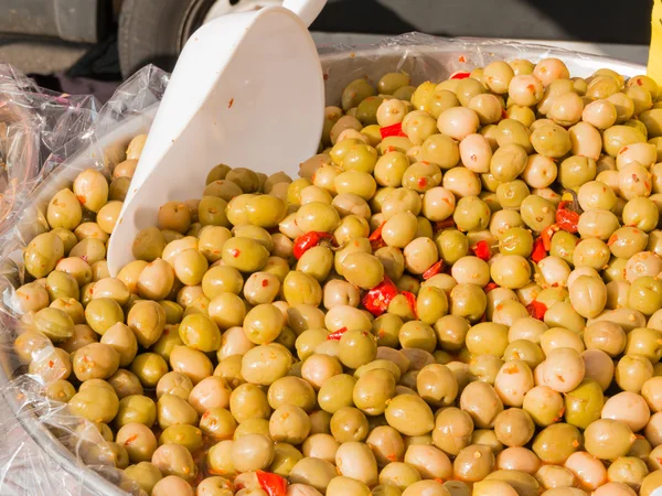 Natural green olives with red peppers — Stock Photo, Image