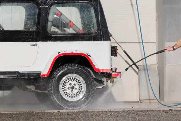 Car wash with a jet of water — Stock Photo, Image