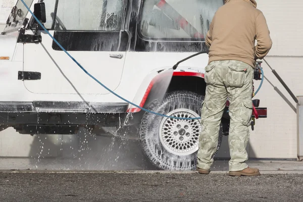 Car wash with jet of water — Stock Photo, Image