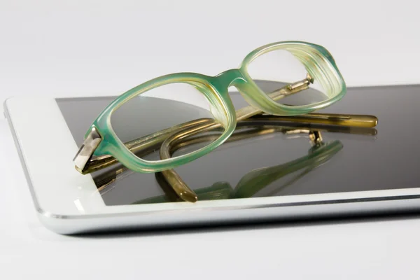 Blue glasses on digital tablet pc — Stock Photo, Image