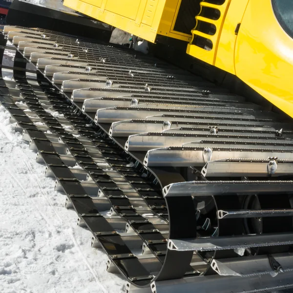 Yellow tracked vehicle on snow, grooming machine — Stock Photo, Image