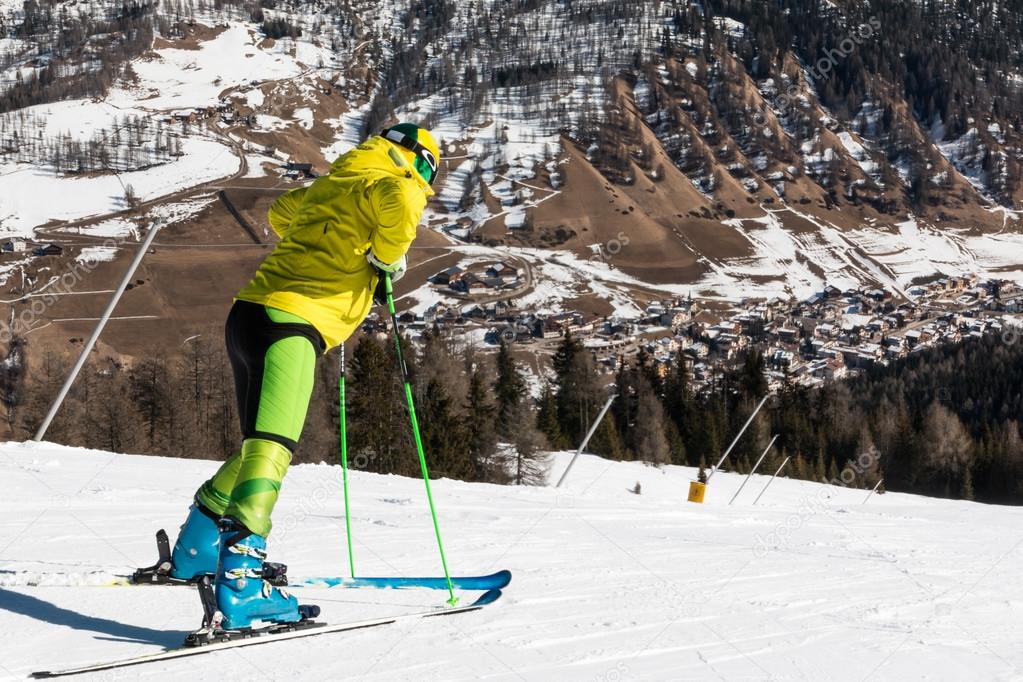 yellow dressed skiers with helmet waiting for skiing