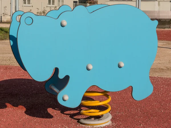 Bouncy colorful spring playground equipment, plastic hippopotamu — Stock Photo, Image