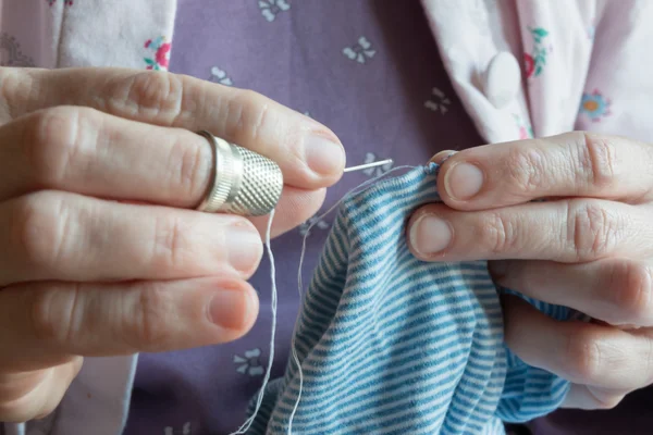 Hemming a dress, woman hands needlework — Stock Photo, Image