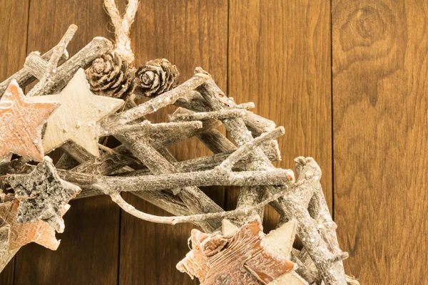 Closeup of christmas decoration with twigs, brown pine cone and — Stock Photo, Image