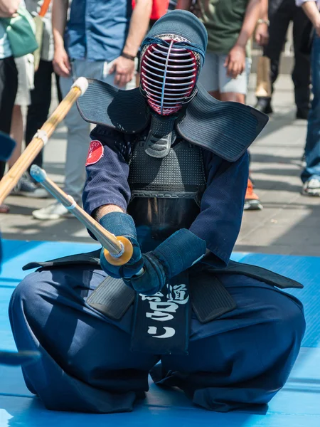 Kendo Warrior on His Knees fighting in Traditional Clothes and B