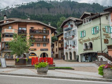 Moena's Charming Alpine Architecture, Square and Flowers - Italy.
