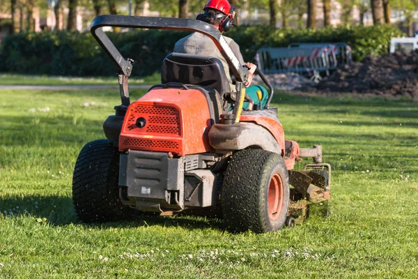 Riding Lawn Equipment with operator — Stock Photo, Image