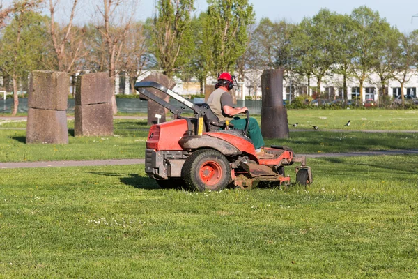 Riding Lawn Equipment with operator — Stock Photo, Image