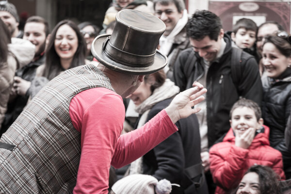 illusionist with magician's hat during street performance