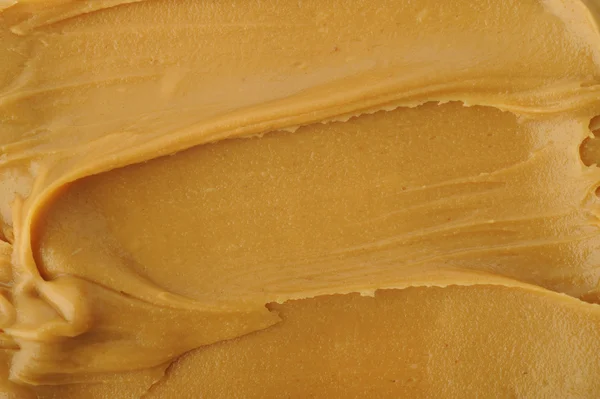 Erdnussbutter auf weißem Hintergrund — Stockfoto