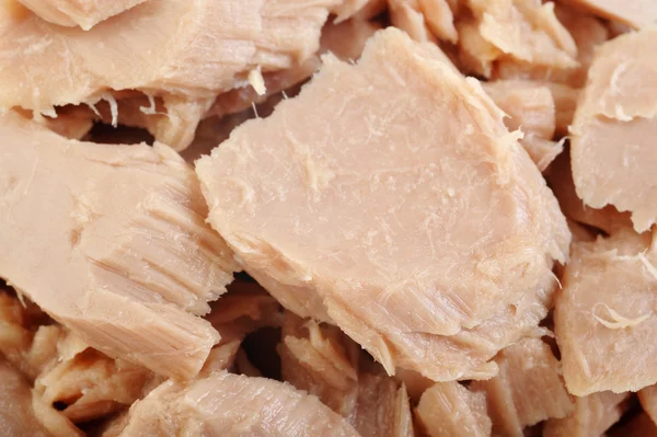 Konserwy rybne tuńczyka na tle — Zdjęcie stockowe