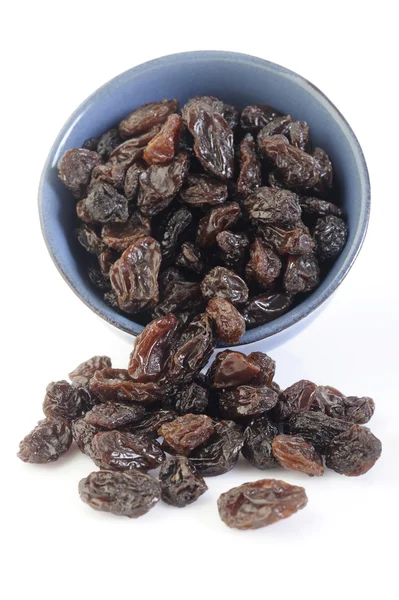 Raisins in blue dish — Stock Photo, Image